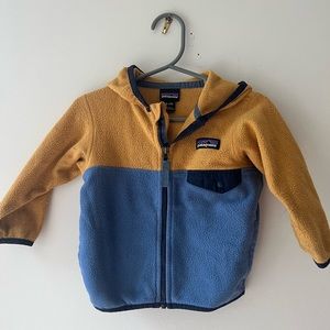 Patagonia fleece jacket in yellow and blue.  Size 6-12 months.